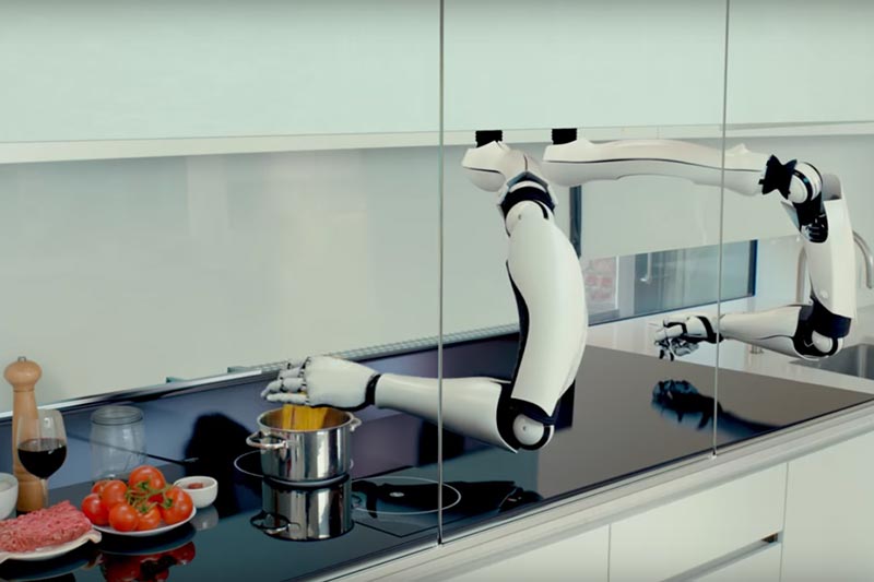 Koch-Roboter Moley arbeitet mit 2 Roboterarmen, die oberhalb einer Küchenarbeitsfläche angebracht sind und sich in Schienen bewegen